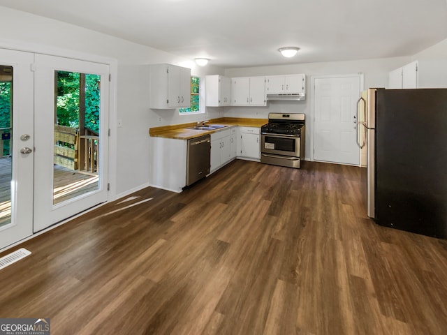 kitchen featuring dark hardwood / wood-style flooring, sink, appliances with stainless steel finishes, and white cabinets