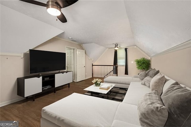 living area with lofted ceiling, ceiling fan, and wood finished floors