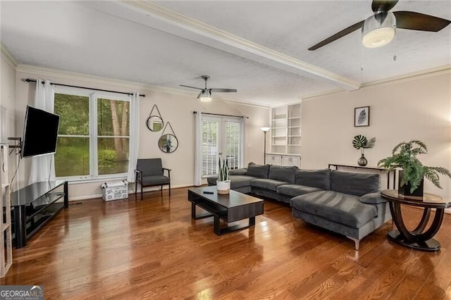 living room with french doors, crown molding, a ceiling fan, wood finished floors, and baseboards