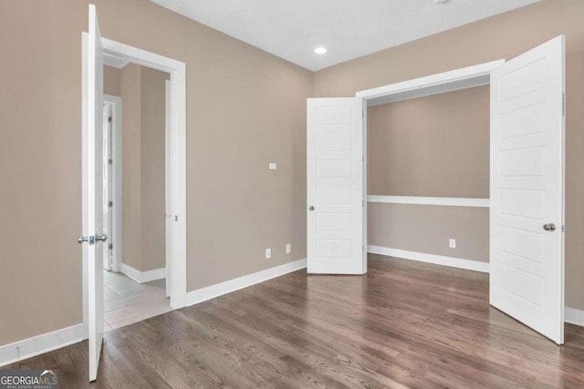 interior space with dark hardwood / wood-style flooring