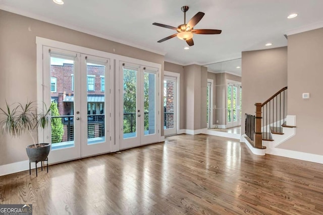 doorway to outside featuring ornamental molding, ceiling fan, french doors, and hardwood / wood-style flooring