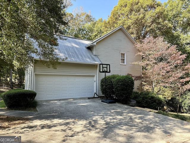 view of property exterior featuring a garage