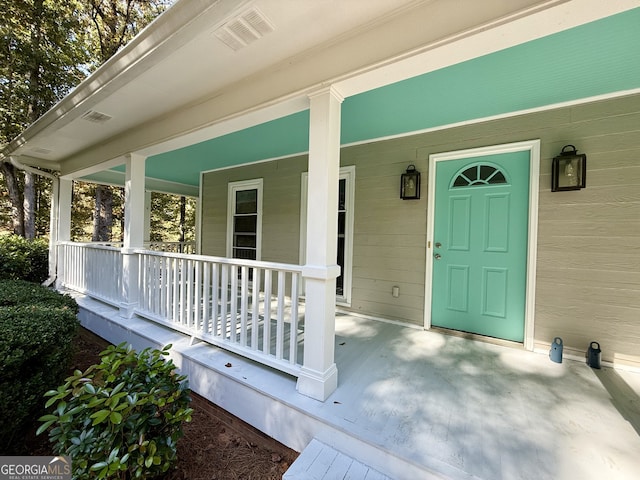 entrance to property with a porch