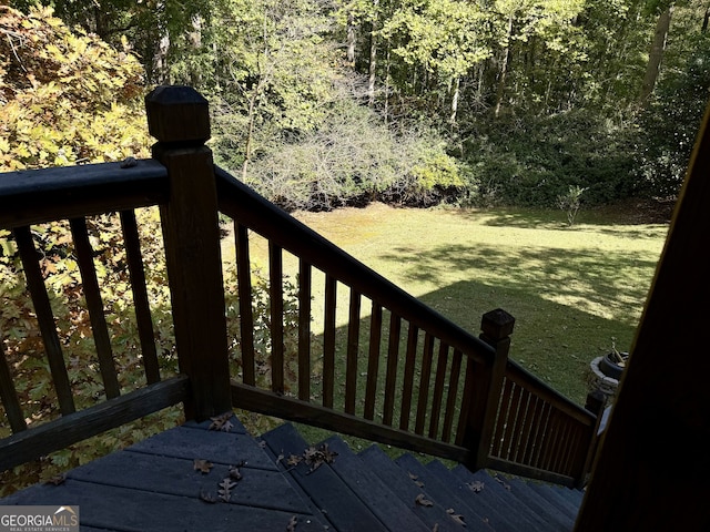 deck featuring a lawn