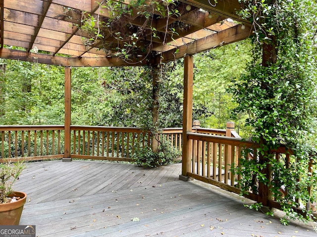 wooden deck featuring a pergola