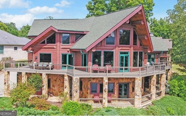 back of house featuring a balcony