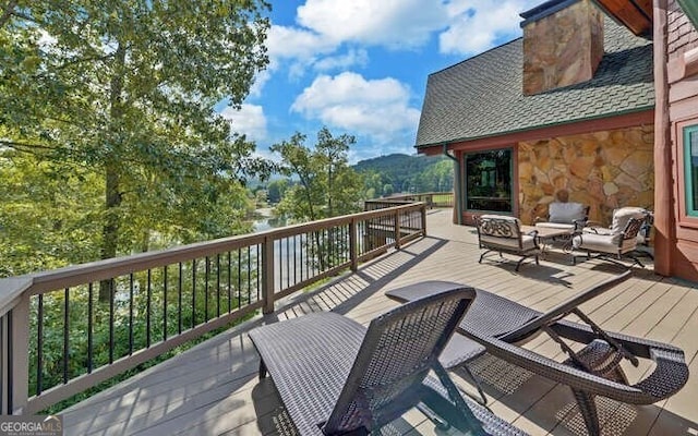 wooden terrace featuring outdoor lounge area