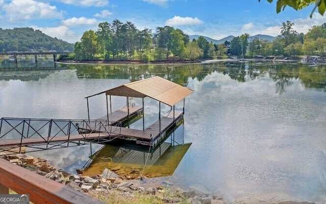 dock area with a water and mountain view