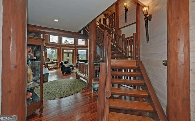 staircase featuring hardwood / wood-style flooring