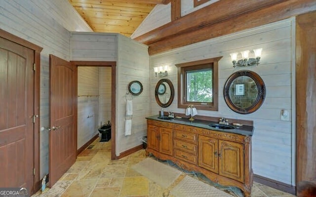 bathroom featuring vanity, wood walls, wood ceiling, and vaulted ceiling