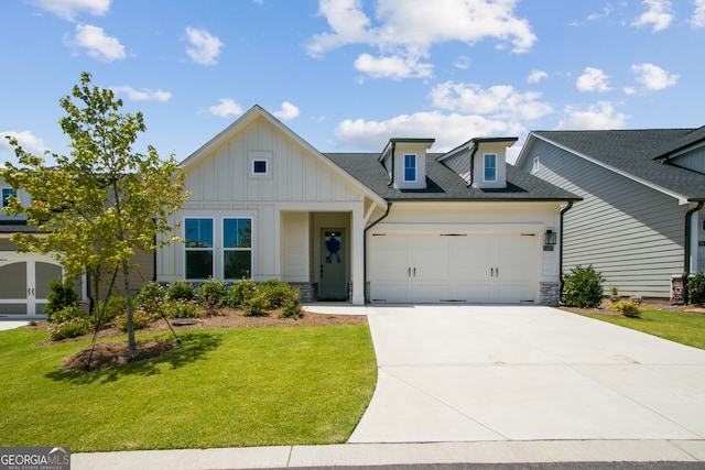 view of front of house with a garage and a front lawn