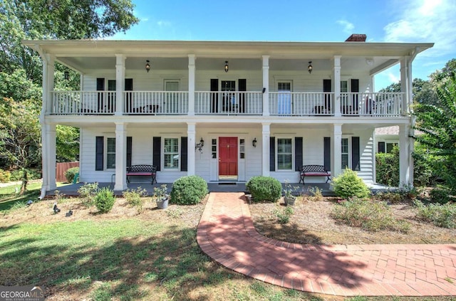 231 Parkview Dr, Cartersville, GA 30120 - view of front facade with a chimney, a balcony, and covered porch