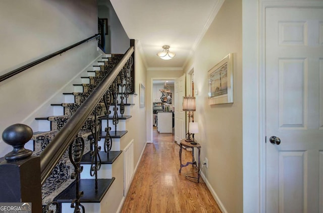 231 Parkview Dr, Cartersville, GA 30120 - hallway featuring light wood-style flooring, baseboards, visible vents, stairs, and crown molding