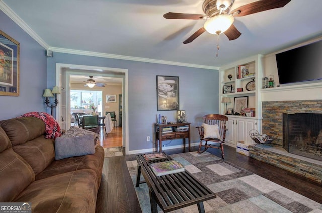 living room with a fireplace, crown molding, wood-type flooring, and ceiling fan