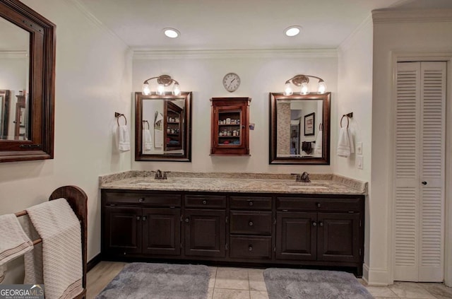 bathroom featuring ornamental molding, vanity, and tile patterned flooring