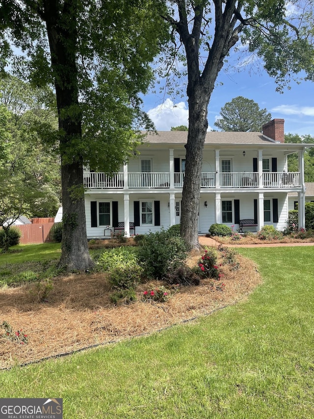 231 Parkview Dr, Cartersville, GA 30120 - view of front of property featuring fence, a chimney, a balcony, and a front yard