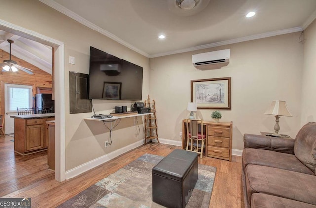 living room with a wall mounted AC, vaulted ceiling, light hardwood / wood-style flooring, ornamental molding, and ceiling fan