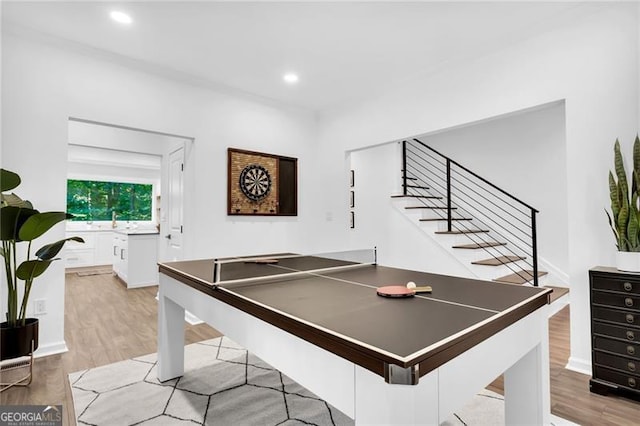 playroom with light hardwood / wood-style floors