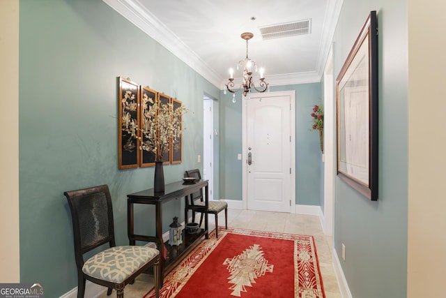 foyer featuring ornamental molding, a chandelier, and light tile patterned floors