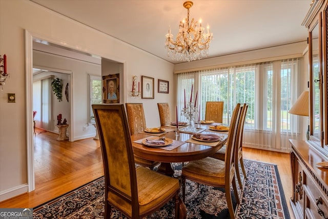 dining space featuring a chandelier and hardwood / wood-style flooring