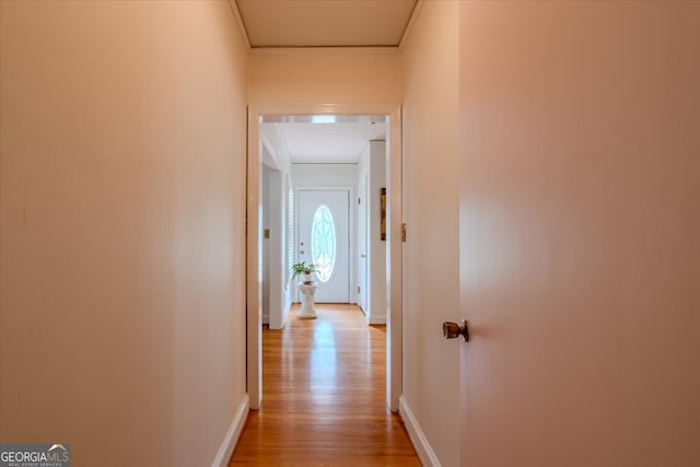 hall with light hardwood / wood-style floors