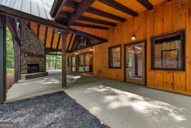 exterior space with an outdoor stone fireplace