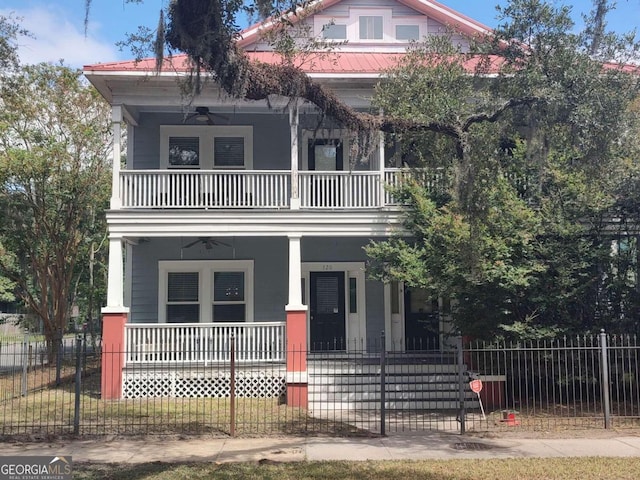 view of front of home featuring ceiling fan, a porch, and a balcony