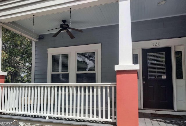 doorway to property featuring ceiling fan and covered porch