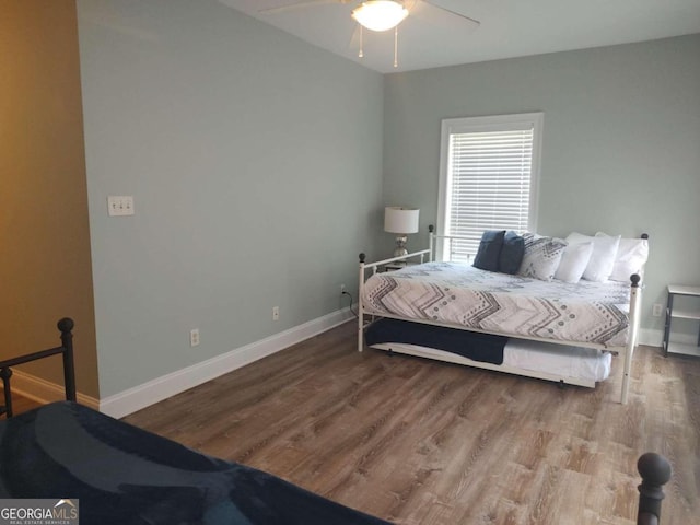 bedroom with hardwood / wood-style floors and ceiling fan