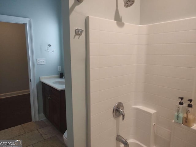 full bathroom featuring shower / bathing tub combination, vanity, and toilet