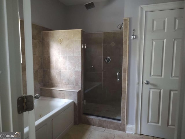 bathroom with plus walk in shower and tile patterned flooring