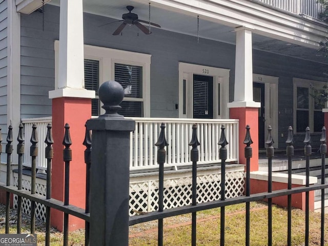 view of gate featuring a porch and ceiling fan