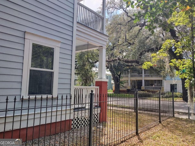 view of side of home with a balcony