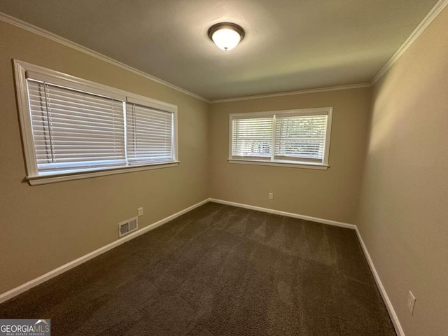 carpeted empty room featuring ornamental molding