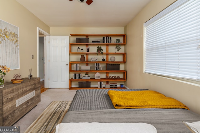 carpeted bedroom featuring ceiling fan