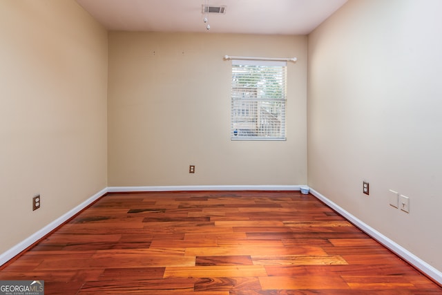 empty room featuring hardwood / wood-style floors