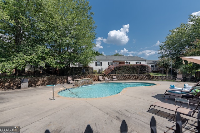 view of pool with a patio