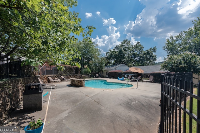 view of swimming pool featuring a patio area