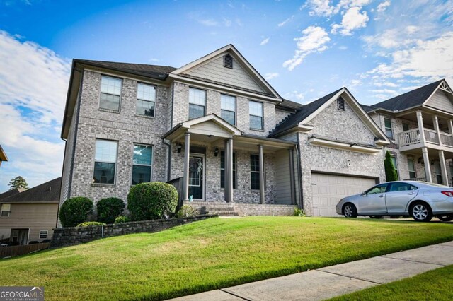 view of front facade with a balcony, a porch, a garage, and a front lawn