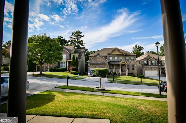 surrounding community featuring a lawn