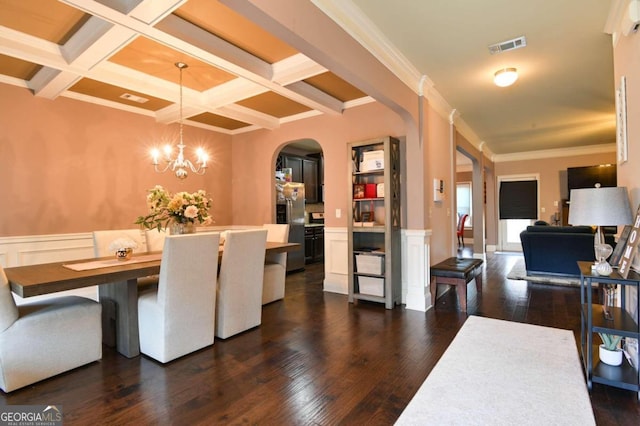 dining room with crown molding, coffered ceiling, beam ceiling, and dark hardwood / wood-style flooring