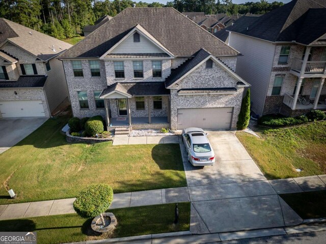 view of front facade with a garage and a front lawn