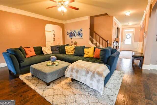 living room featuring ornamental molding, hardwood / wood-style flooring, and ceiling fan