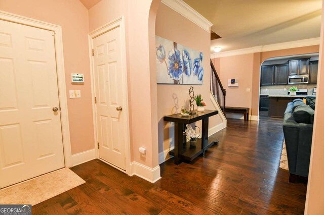 entrance foyer with dark hardwood / wood-style floors