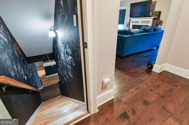 staircase featuring hardwood / wood-style flooring