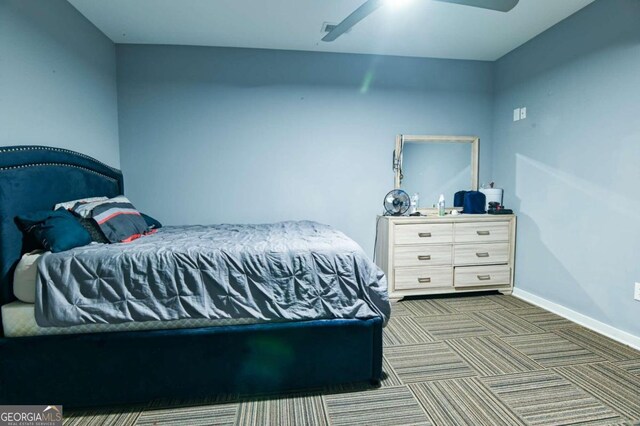 carpeted bedroom featuring ceiling fan