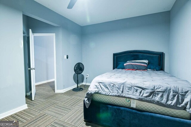 carpeted bedroom featuring ceiling fan