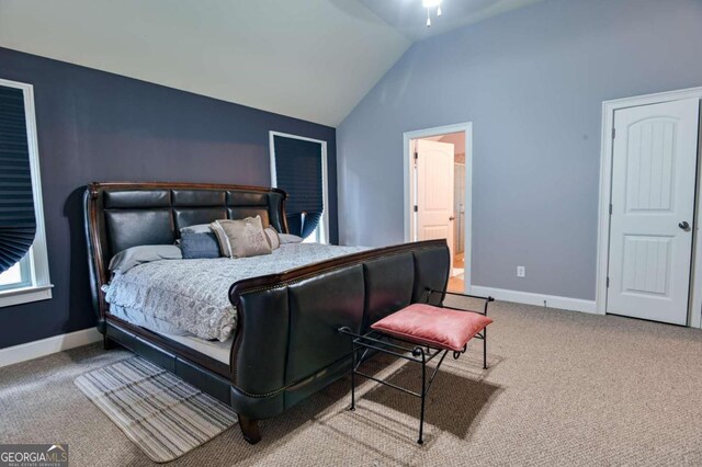 carpeted bedroom featuring lofted ceiling