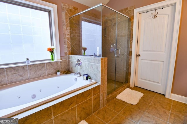 bathroom with tile patterned flooring and independent shower and bath