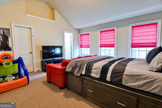 bedroom featuring light carpet and vaulted ceiling